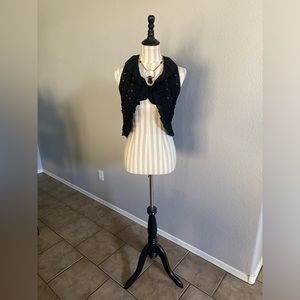 Black ruffle vest